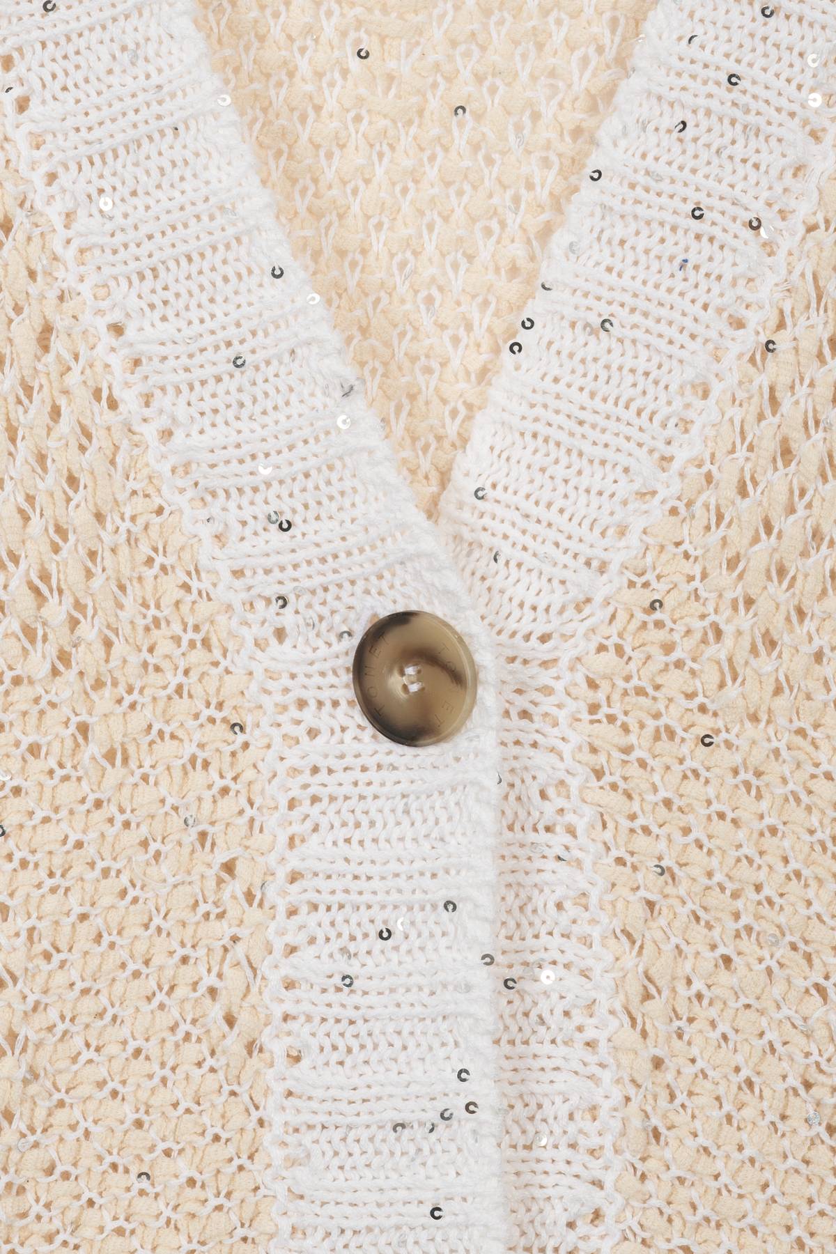 Cardigan con bordi in paillettes